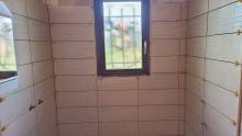 Artisan carreleur pour la pose de faïence 25x40 dans une douche à l'italienne à Fécamp 76